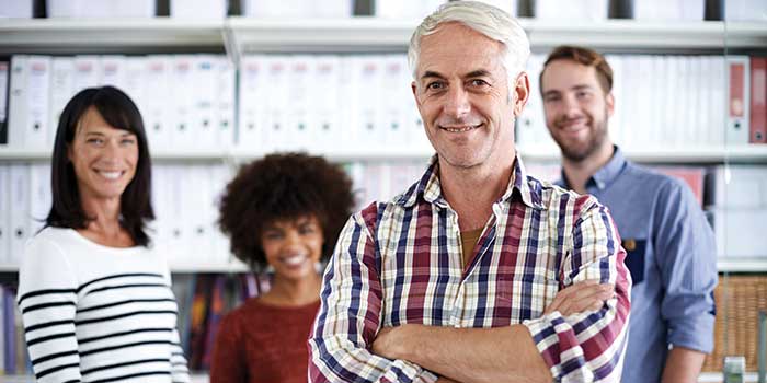 Man in office with hearing aids